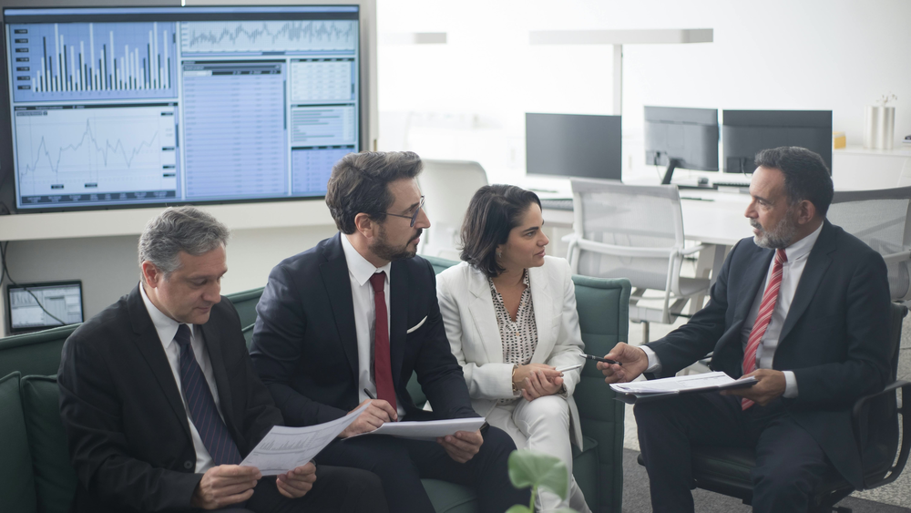 Finance team discussing how to implement FFIEC software escrow requirements.