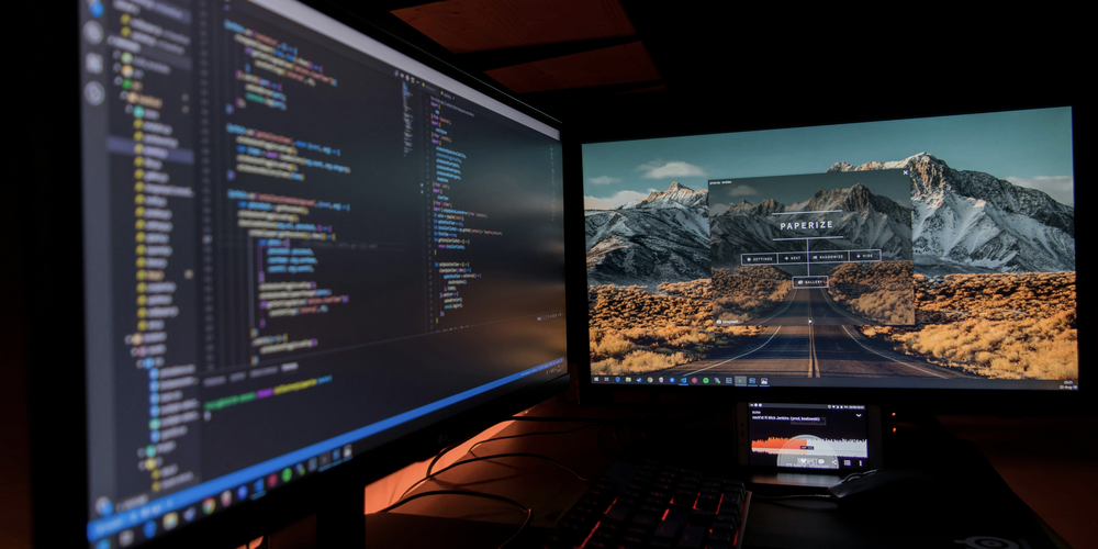 A shot of two different screens, one with code and one with a running application. 